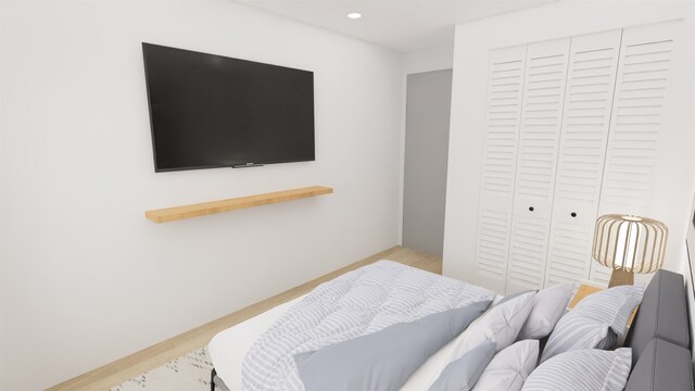 1316 W Willis St, Alvin, TX 77511 - bedroom featuring a closet, recessed lighting, and wood finished floors