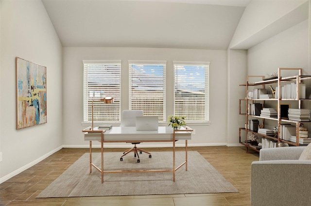 8426 Kari Bend Cir, Richmond, TX 77407 - office space featuring vaulted ceiling and wood finished floors