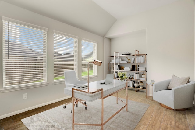 8426 Kari Bend Cir, Richmond, TX 77407 - home office featuring wood finished floors and lofted ceiling