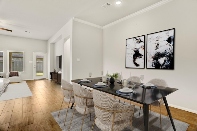 8426 Kari Bend Cir, Richmond, TX 77407 - dining space featuring wood finished floors, crown molding, and recessed lighting
