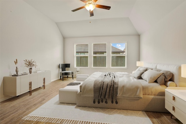 8426 Kari Bend Cir, Richmond, TX 77407 - bedroom featuring wood finished floors, lofted ceiling, and a ceiling fan