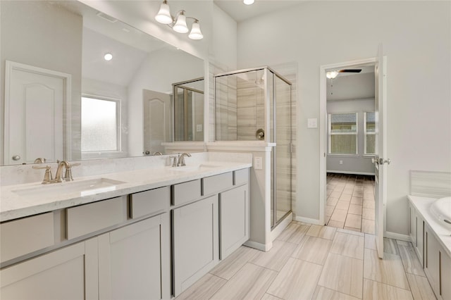 8426 Kari Bend Cir, Richmond, TX 77407 - bathroom with a shower stall, double vanity, a tub to relax in, lofted ceiling, and recessed lighting