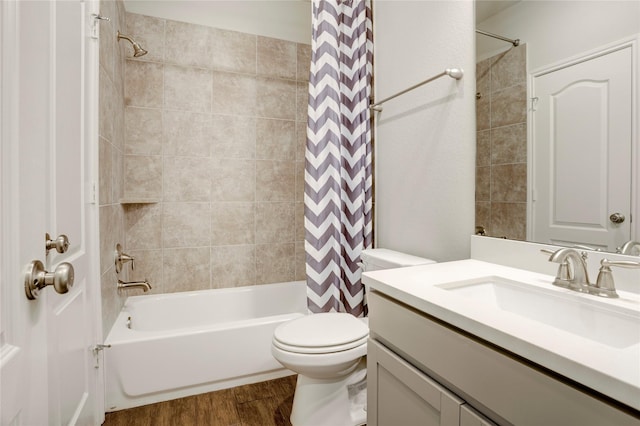 8426 Kari Bend Cir, Richmond, TX 77407 - full bathroom featuring wood finished floors, vanity, and shower / tub combo with curtain