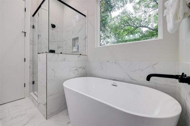 846 Elkhart St Unit B, Houston, TX 77091 - bathroom featuring a marble finish shower, a freestanding bath, and marble finish flooring