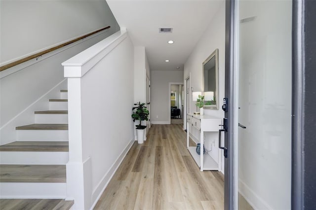 846 Elkhart St Unit B, Houston, TX 77091 - hallway with light wood-style floors, stairs, and recessed lighting
