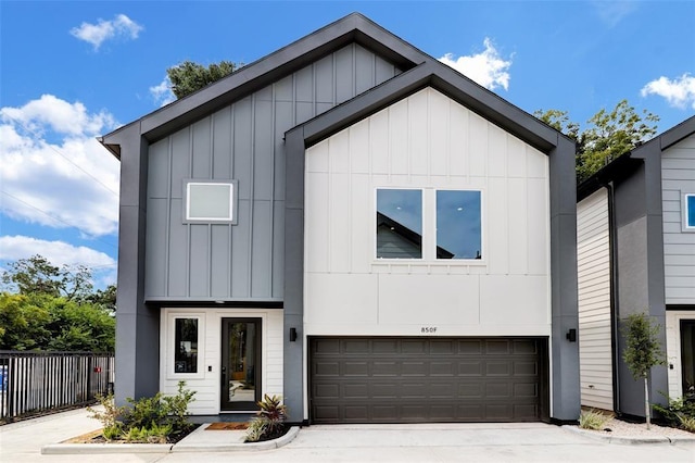 846 Elkhart St Unit B, Houston, TX 77091 - view of front of home with board and batten siding, an attached garage, and concrete driveway
