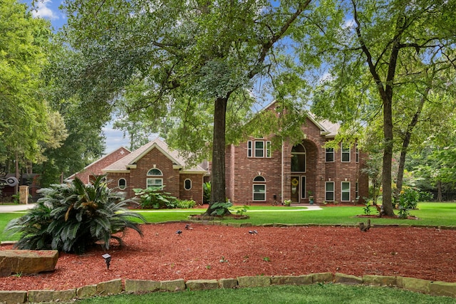10530 Clubhouse Cir, Magnolia, TX 77354 - view of front of property featuring a front yard and brick siding