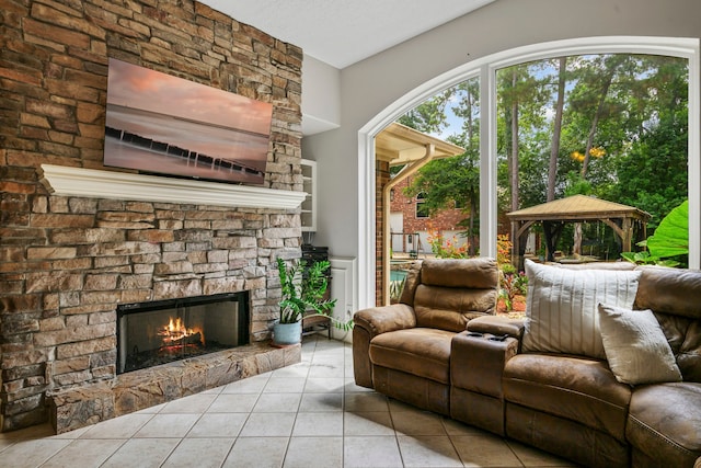 10530 Clubhouse Cir, Magnolia, TX 77354 - tiled living area featuring a stone fireplace