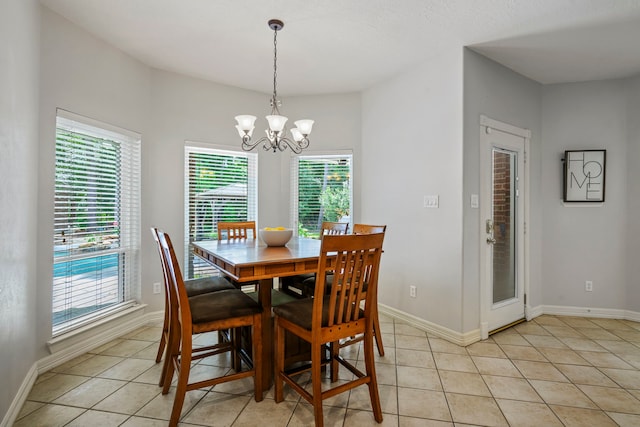 10530 Clubhouse Cir, Magnolia, TX 77354 - dining space featuring light tile patterned floors and a chandelier