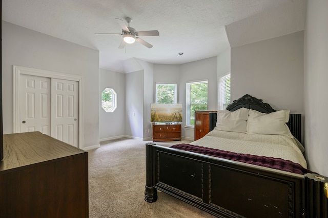 10530 Clubhouse Cir, Magnolia, TX 77354 - bedroom with light carpet, a ceiling fan, and a closet