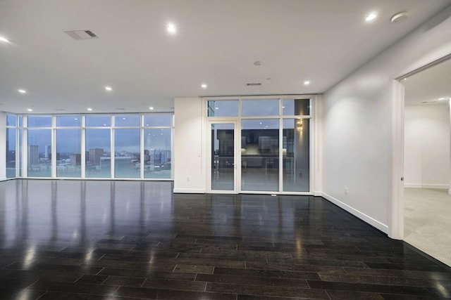 4521 San Felipe St Unit 2304-5, Houston, TX 77027 - unfurnished room featuring wood finished floors, a smoke detector, recessed lighting, and expansive windows