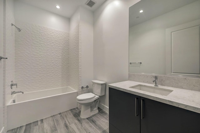 4521 San Felipe St Unit 2304-5, Houston, TX 77027 - bathroom featuring vanity, washtub / shower combination, wood finished floors, and recessed lighting