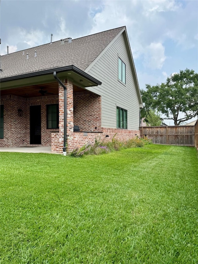 1701 Bayram Dr, Houston, TX 77055 - back of house with roof with shingles, brick siding, and a patio