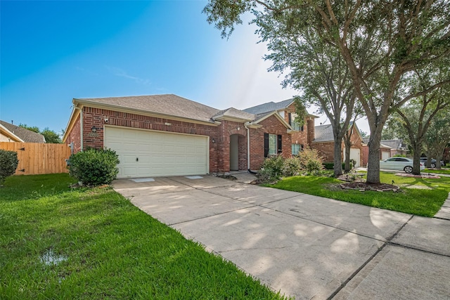 19914 Pemetic Trl, Richmond, TX 77407 - view of front of home featuring an attached garage, brick siding, driveway, and roof with shingles