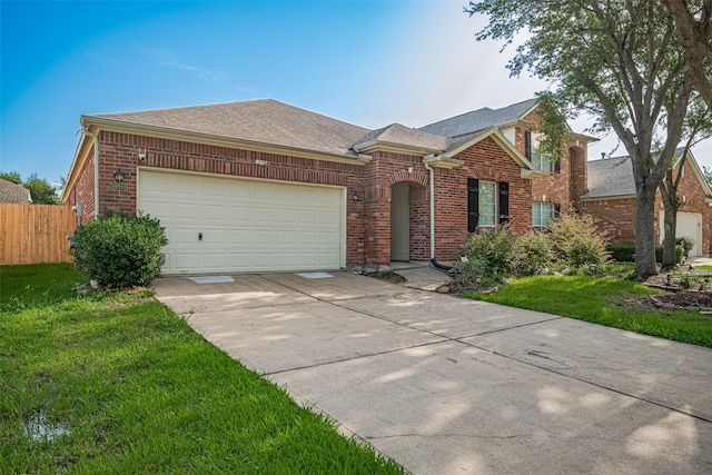 19914 Pemetic Trl, Richmond, TX 77407 - view of front of home featuring brick siding, concrete driveway, a garage, and a shingled roof