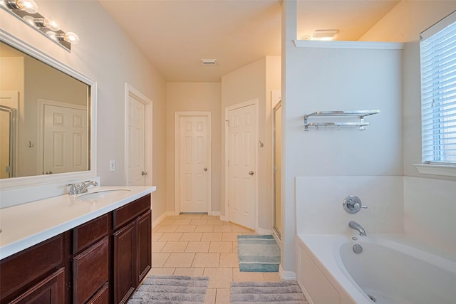 19914 Pemetic Trl, Richmond, TX 77407 - bathroom featuring a bath, tile patterned flooring, vanity, and a shower stall