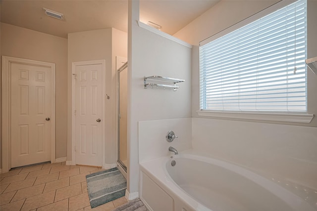 19914 Pemetic Trl, Richmond, TX 77407 - bathroom featuring a garden tub, tile patterned flooring, and a stall shower