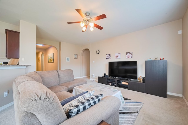 19914 Pemetic Trl, Richmond, TX 77407 - carpeted living area featuring arched walkways and ceiling fan