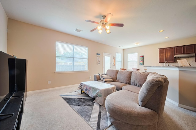 19914 Pemetic Trl, Richmond, TX 77407 - living area with light colored carpet, a ceiling fan, and recessed lighting