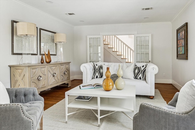 1656 Norfolk St, Houston, TX 77006 - living area with dark wood-style flooring, ornamental molding, and stairs