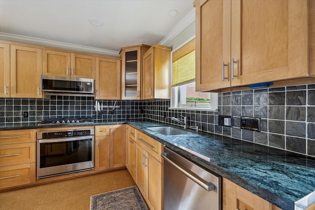 1656 Norfolk St, Houston, TX 77006 - kitchen featuring stainless steel appliances, crown molding, glass insert cabinets, tasteful backsplash, and dark stone countertops