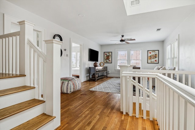 1656 Norfolk St, Houston, TX 77006 - stairway with wood finished floors and a ceiling fan