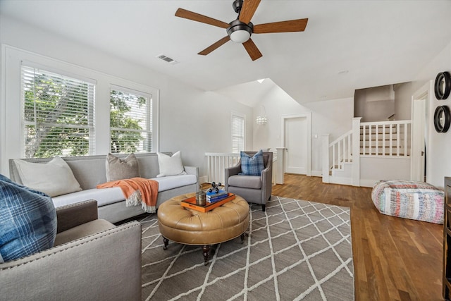 1656 Norfolk St, Houston, TX 77006 - living area featuring a ceiling fan, wood finished floors, lofted ceiling, and stairway