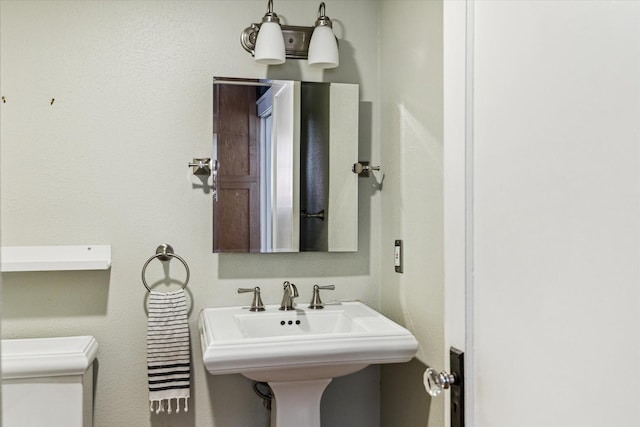 1656 Norfolk St, Houston, TX 77006 - bathroom featuring toilet and a sink
