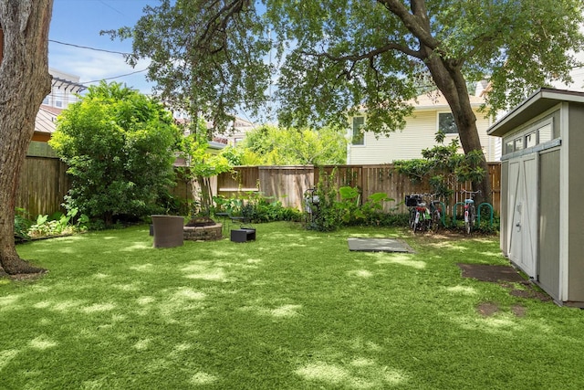 1656 Norfolk St, Houston, TX 77006 - fenced backyard featuring a storage shed