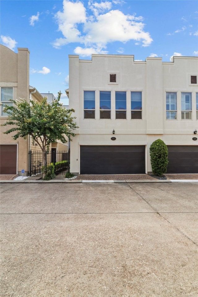 112 Riley Ln, Houston, TX 77003 - multi unit property with stucco siding, concrete driveway, and a garage