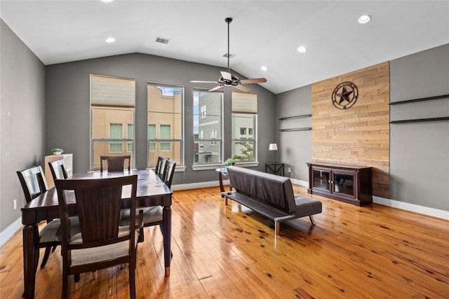 112 Riley Ln, Houston, TX 77003 - dining room featuring vaulted ceiling, a ceiling fan, light wood finished floors, recessed lighting, and a fireplace