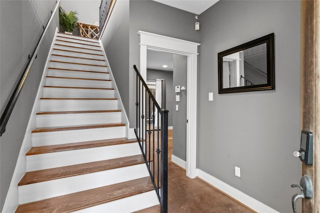 112 Riley Ln, Houston, TX 77003 - stairway featuring concrete floors and baseboards