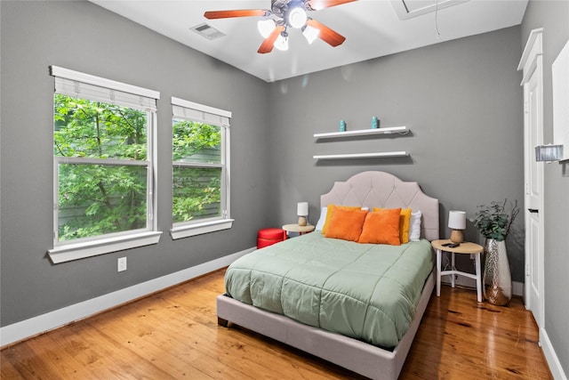 112 Riley Ln, Houston, TX 77003 - bedroom featuring attic access, hardwood / wood-style floors, and a ceiling fan