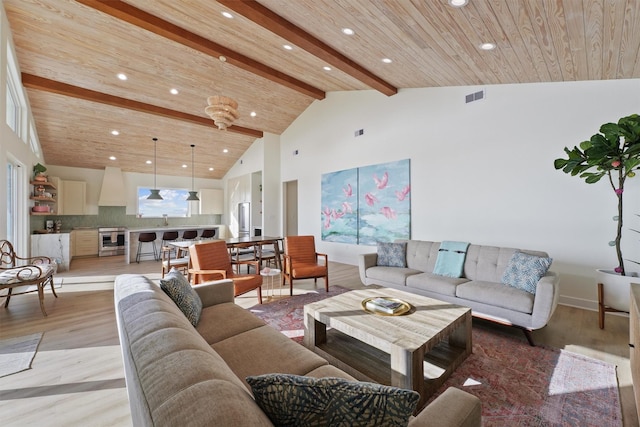 3430 Indian Beach Dr, Galveston, TX 77554 - living room featuring light wood-type flooring, beamed ceiling, recessed lighting, and high vaulted ceiling