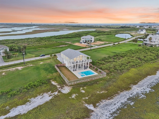3430 Indian Beach Dr, Galveston, TX 77554 - aerial view at dusk of a water view and view of pool
