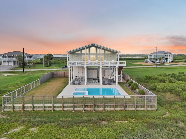3430 Indian Beach Dr, Galveston, TX 77554 - back of property featuring a fenced backyard, stairway, a patio area, and a pool with connected hot tub