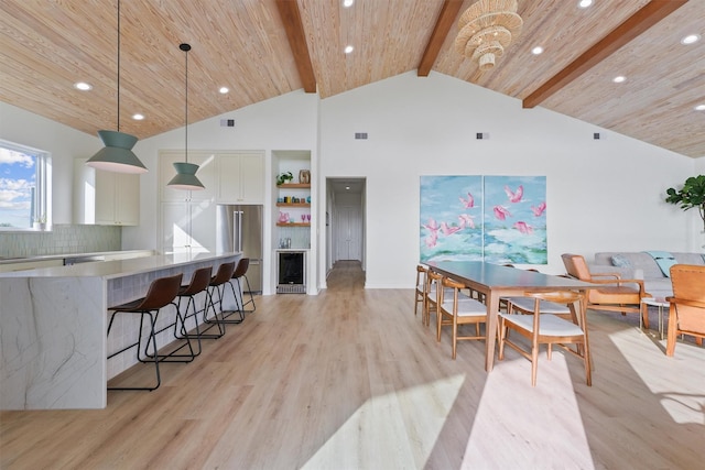 3430 Indian Beach Dr, Galveston, TX 77554 - dining area featuring recessed lighting, light wood-style flooring, wine cooler, high vaulted ceiling, and a wood ceiling with exposed beams
