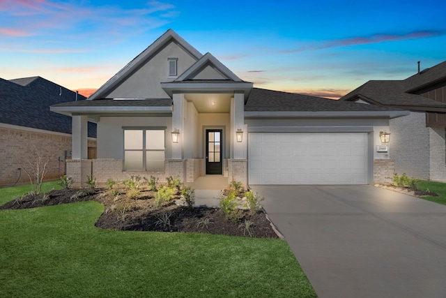 21410 Flora Springs Ln, Magnolia, TX 77355 - view of front of property with brick siding, a garage, driveway, a front yard, and stucco siding