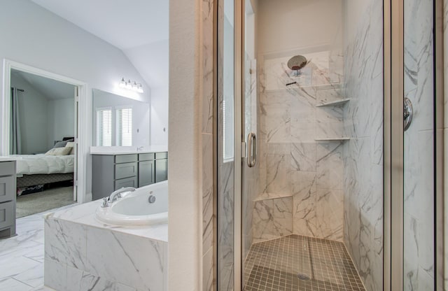 20207 Noble Arabian Dr, Tomball, TX 77377 - full bath featuring a marble finish shower, connected bathroom, a garden tub, lofted ceiling, and marble finish floors