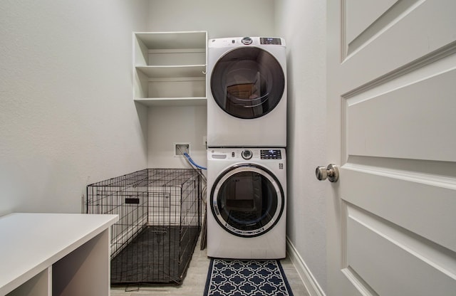 20207 Noble Arabian Dr, Tomball, TX 77377 - laundry room with stacked washer / drying machine and baseboards
