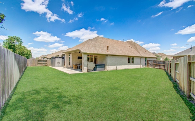 20207 Noble Arabian Dr, Tomball, TX 77377 - back of house featuring a patio, a fenced backyard, brick siding, and roof with shingles