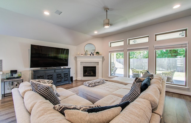 20207 Noble Arabian Dr, Tomball, TX 77377 - living room featuring ceiling fan, wood finished floors, a glass covered fireplace, recessed lighting, and vaulted ceiling