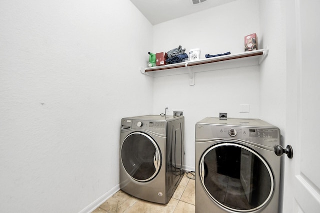 6810 Hunters Trace Ln, Baytown, TX 77521 - washroom featuring washer and clothes dryer and baseboards
