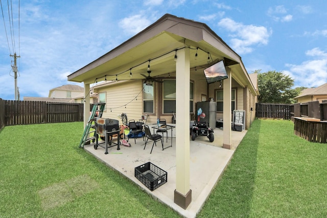 6810 Hunters Trace Ln, Baytown, TX 77521 - rear view of property featuring a fenced backyard, a patio area, and ceiling fan