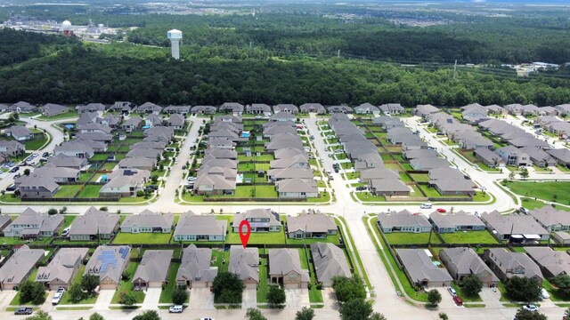 6810 Hunters Trace Ln, Baytown, TX 77521 - aerial view of residential area with a heavily wooded area