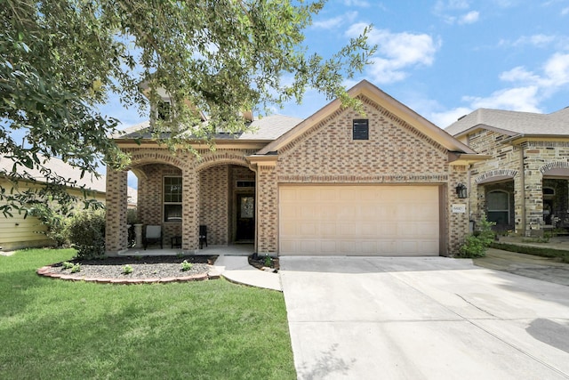 6810 Hunters Trace Ln, Baytown, TX 77521 - view of front of property with an attached garage, concrete driveway, a front lawn, and a porch