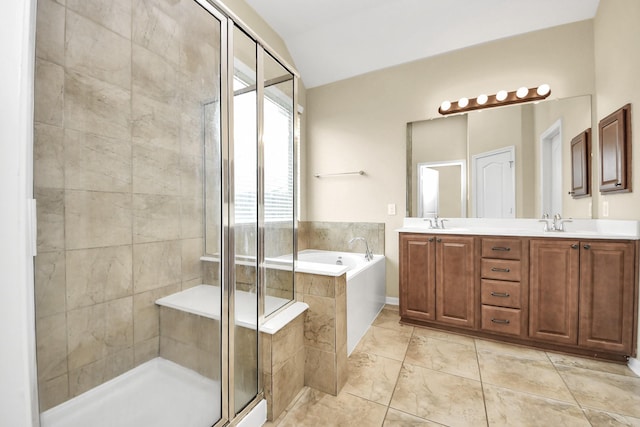 6810 Hunters Trace Ln, Baytown, TX 77521 - full bath featuring a bath, a shower stall, double vanity, vaulted ceiling, and tile patterned floors