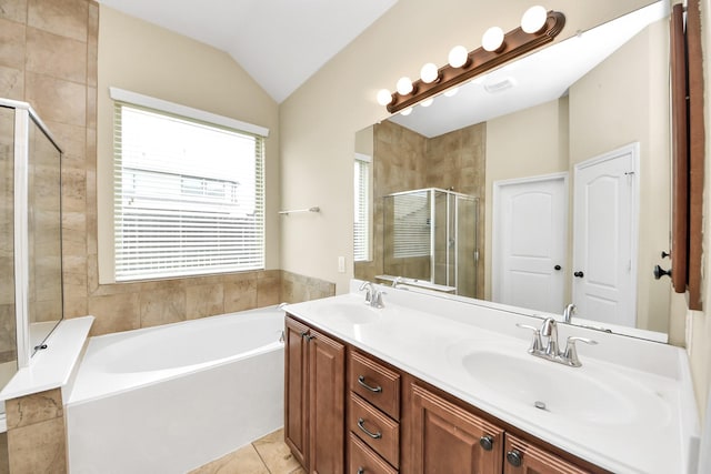 6810 Hunters Trace Ln, Baytown, TX 77521 - bathroom featuring a bath, a shower stall, double vanity, vaulted ceiling, and tile patterned flooring