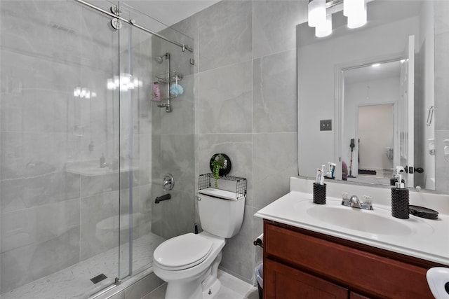 13206 Blass Ct, Houston, TX 77044 - full bathroom with vanity, a stall shower, and tile walls