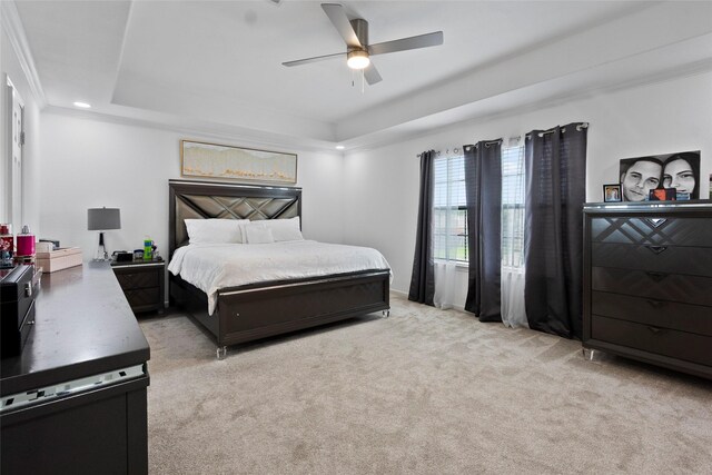 13206 Blass Ct, Houston, TX 77044 - bedroom featuring a raised ceiling, light colored carpet, a ceiling fan, and recessed lighting